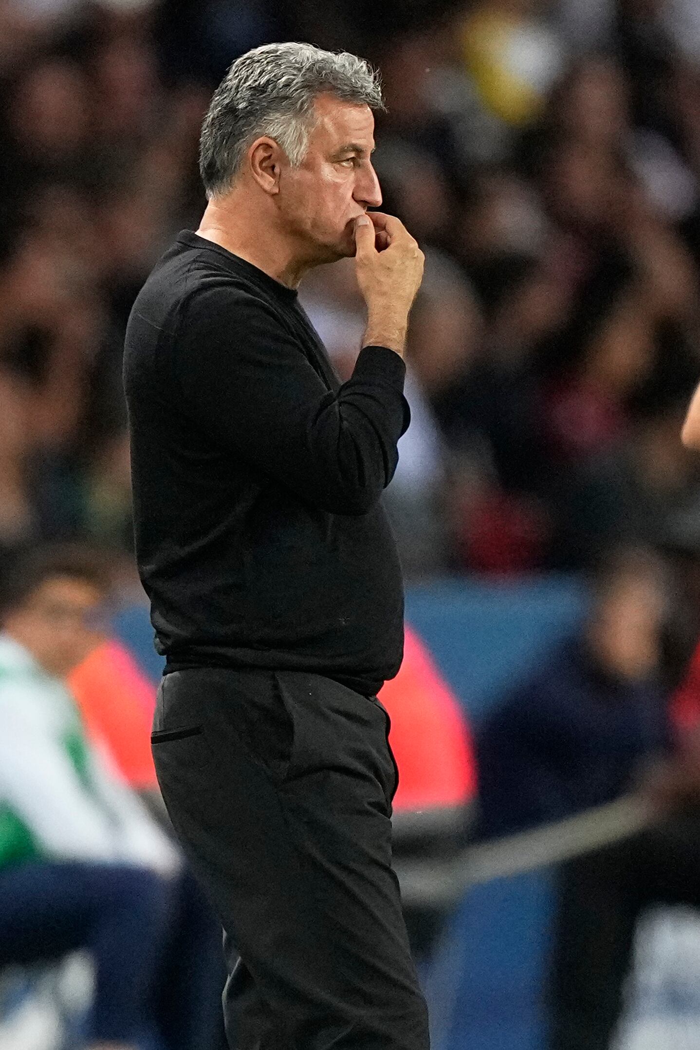 PSG's head coach Christophe Galtier looks at the field during the French League One soccer match between Paris Saint-Germain and Clermont at the Parc des Princes in Paris, France, Saturday, June 3, 2023. (AP Photo/Michel Euler)