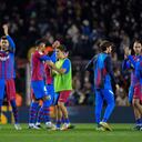 FC Barcelona's players celebrates at the end of the Spanish league football match between FC Barcelona and RCD Espanyol, at the Camp Nou stadium in Barcelona on November 20, 2021. (Photo by Pau BARRENA / AFP)