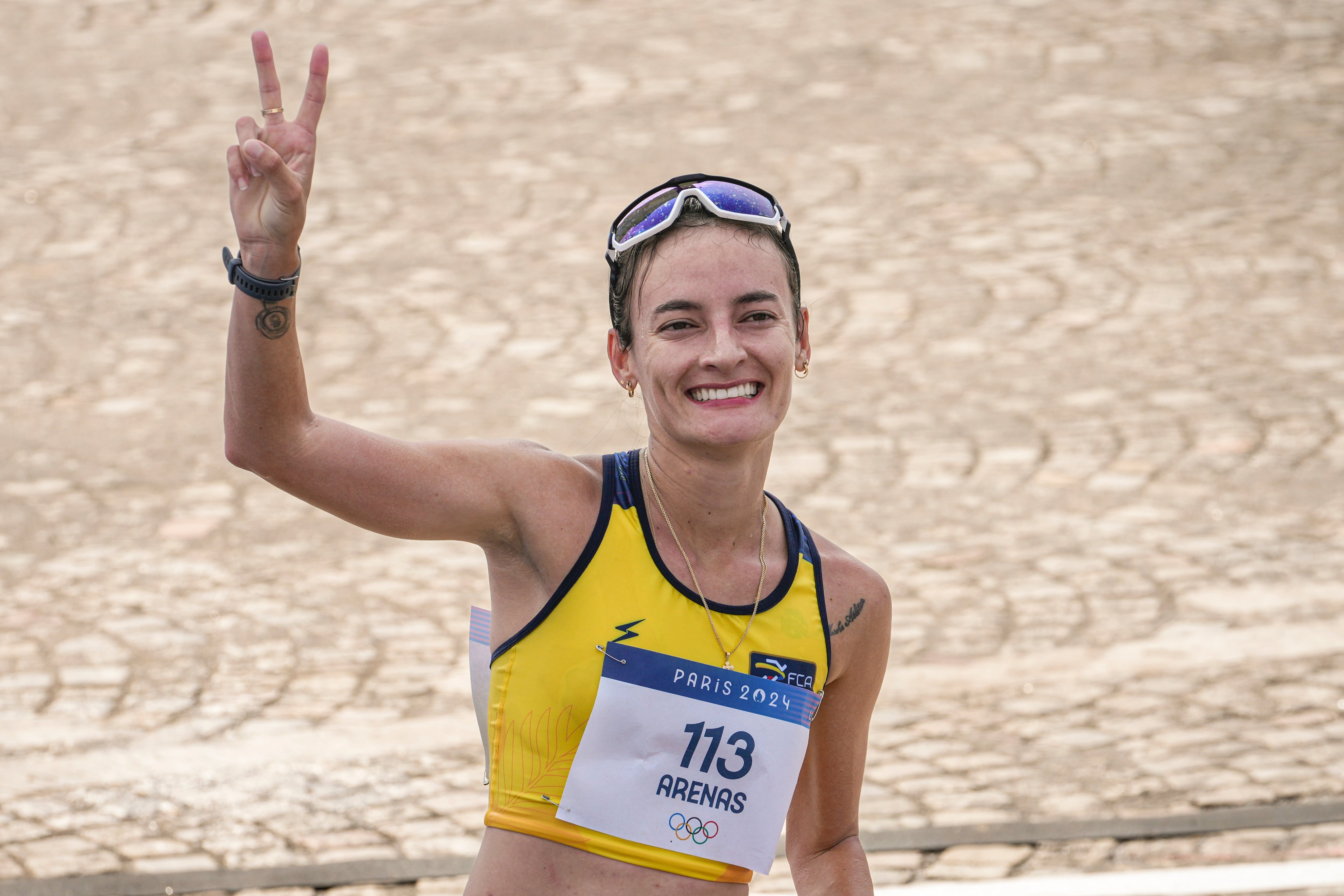 Lorena Arenas, of Columbia, celebrates after crossing the finish line at the end of the women's 20km race walk at the 2024 Summer Olympics, Thursday, Aug. 1, 2024, in Paris, France. (AP Photo/Dar Yasin)