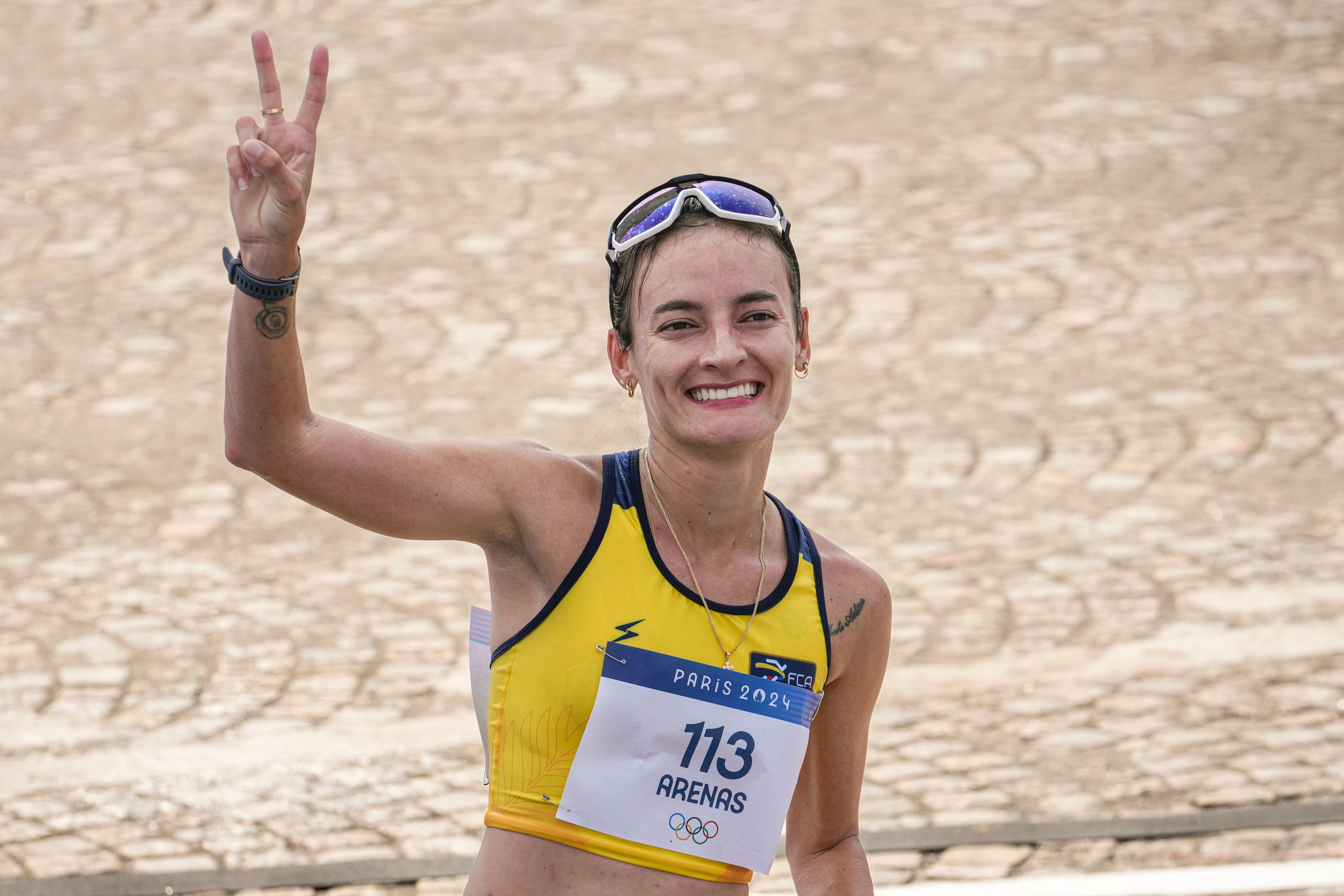 Lorena Arenas, of Columbia, celebrates after crossing the finish line at the end of the women's 20km race walk at the 2024 Summer Olympics, Thursday, Aug. 1, 2024, in Paris, France. (AP Photo/Dar Yasin)