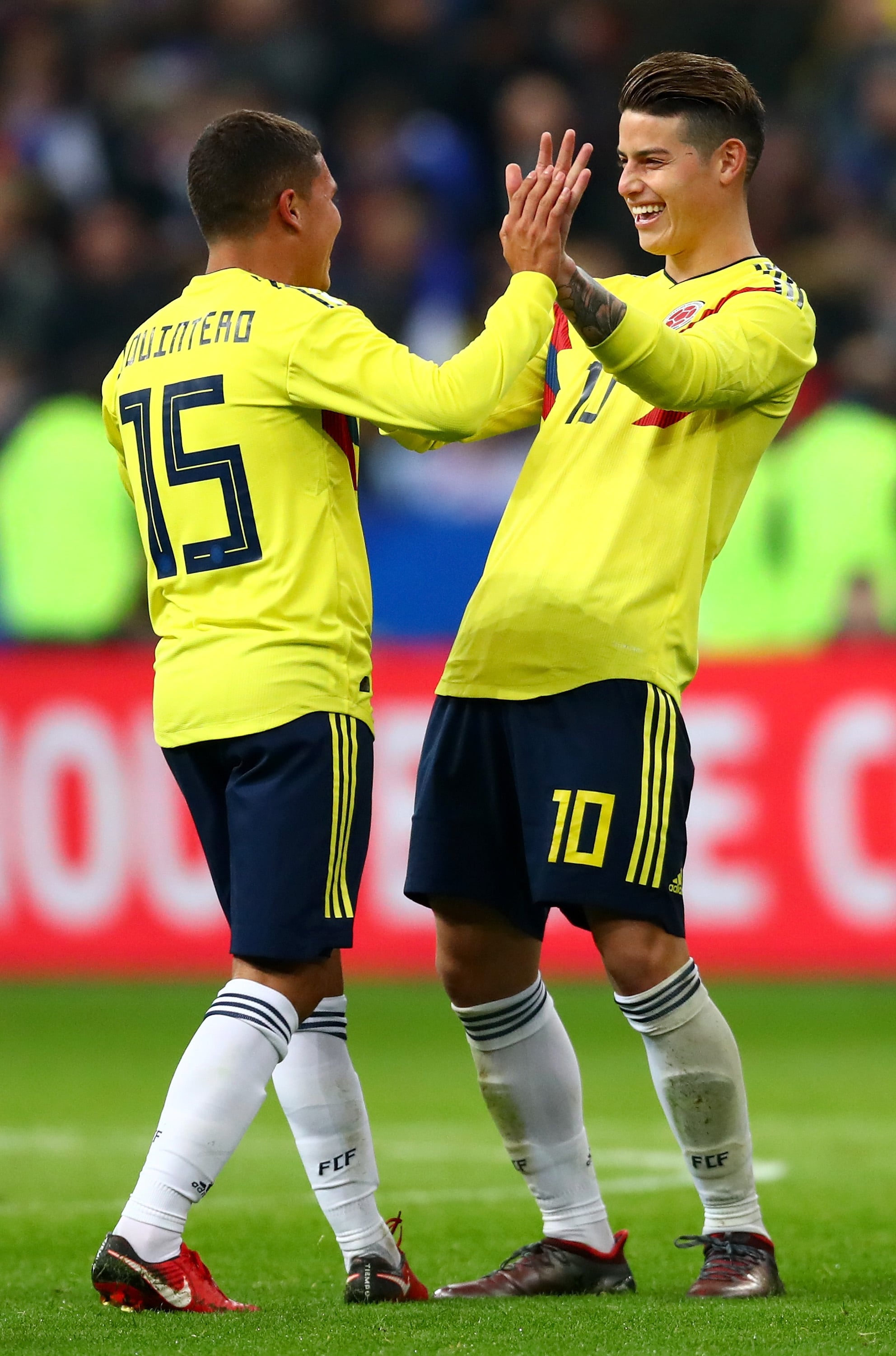 PARIS, FRANCE - MARCH 23:  Juan Quintero of Columbia celebrates with teammate James Rodríguez after scoring his sides third goal during the International friendly match between France and Columbia at Stade de France on March 23, 2018 in Paris, France.  (Photo by Clive Rose/Getty Images)