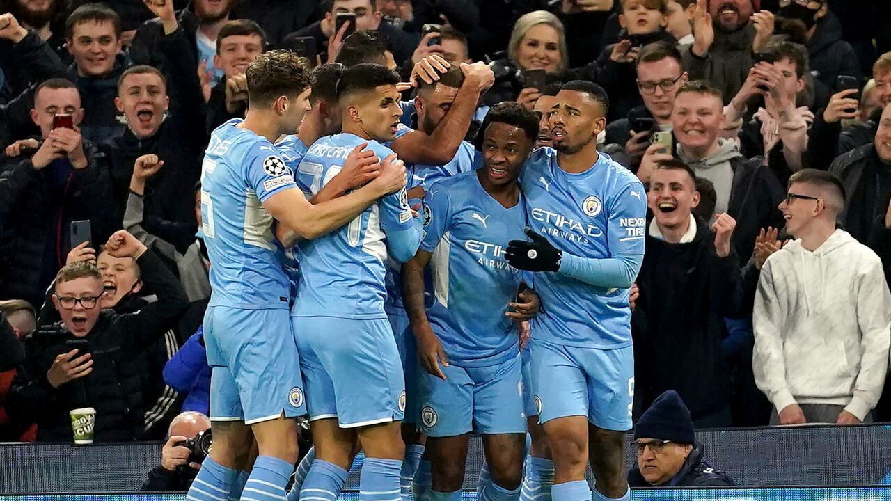 Manchester City's Raheem Sterling, second right, celebrates scoring with teammates during the Champions League, Group A match between Manchester City and Paris Saint-Germain at the Etihad Stadium, Manchester, England, Wednesday Nov. 24, 2021. (Tim Goode/PA via AP)
