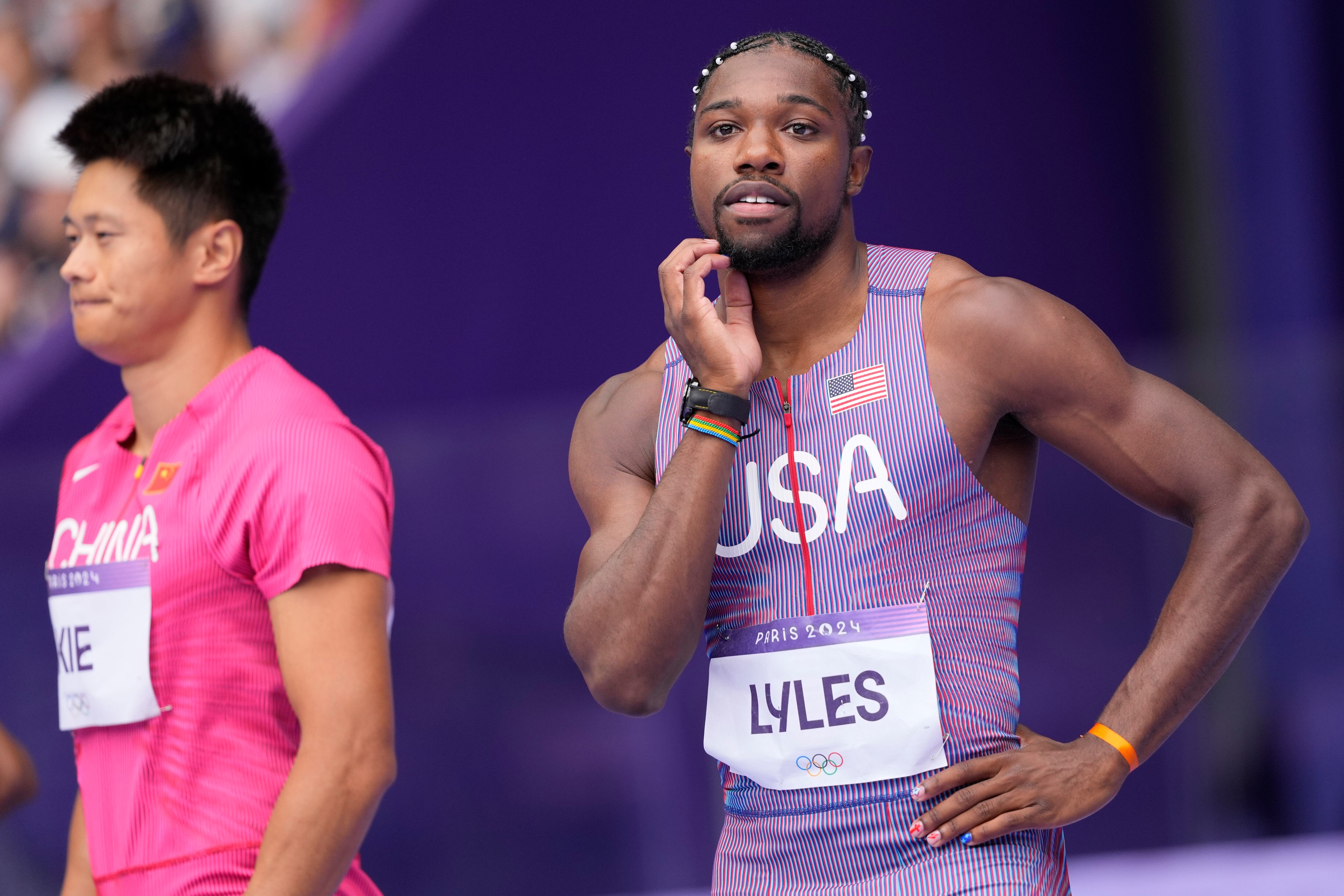 Noah Lyles, of the United States, prepares for his heat in the men's 100-meters at the 2024 Summer Olympics, Saturday, Aug. 3, 2024, in Saint-Denis, France. (AP Photo/Bernat Armangue)