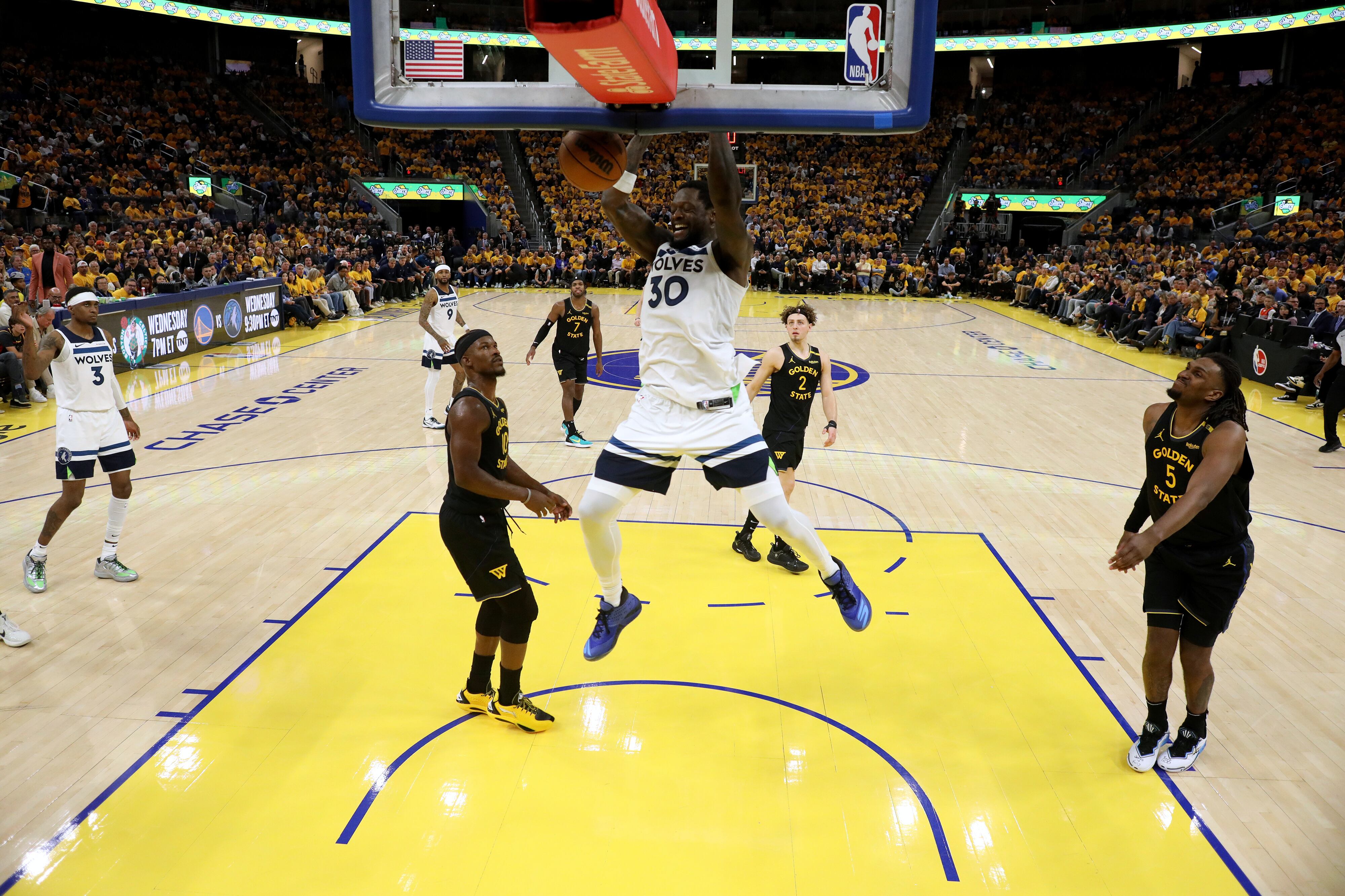 Minnesota Timberwolves forward Julius Randle (30) dunks the ball against Golden State Warriors forward Jimmy Butler III (10) during the second half of Game 4 in the Western Conference semifinals of the NBA basketball playoffs Monday, May 12, 2025, in San Francisco. (AP Photo/Jed Jacobsohn)