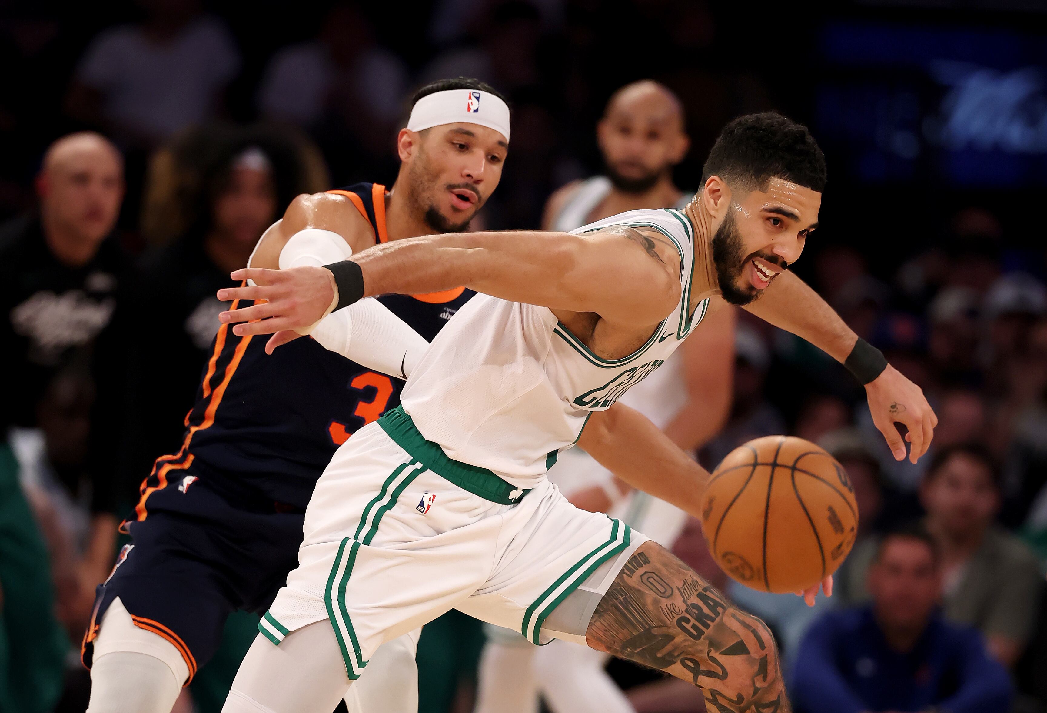 NEW YORK, NEW YORK - MAY 12: Jayson Tatum #0 of the Boston Celtics chases after a loose ball as Josh Hart #3 of the New York Knicks defends in Game Four of the Eastern Conference Second Round NBA Playoffs at Madison Square Garden on May 12, 2025 in New York City. NOTE TO USER: User expressly acknowledges and agrees that, by downloading and or using this photograph, User is consenting to the terms and conditions of the Getty Images License Agreement. (Photo by Elsa/Getty Images). (Photo by Elsa/Getty Images)