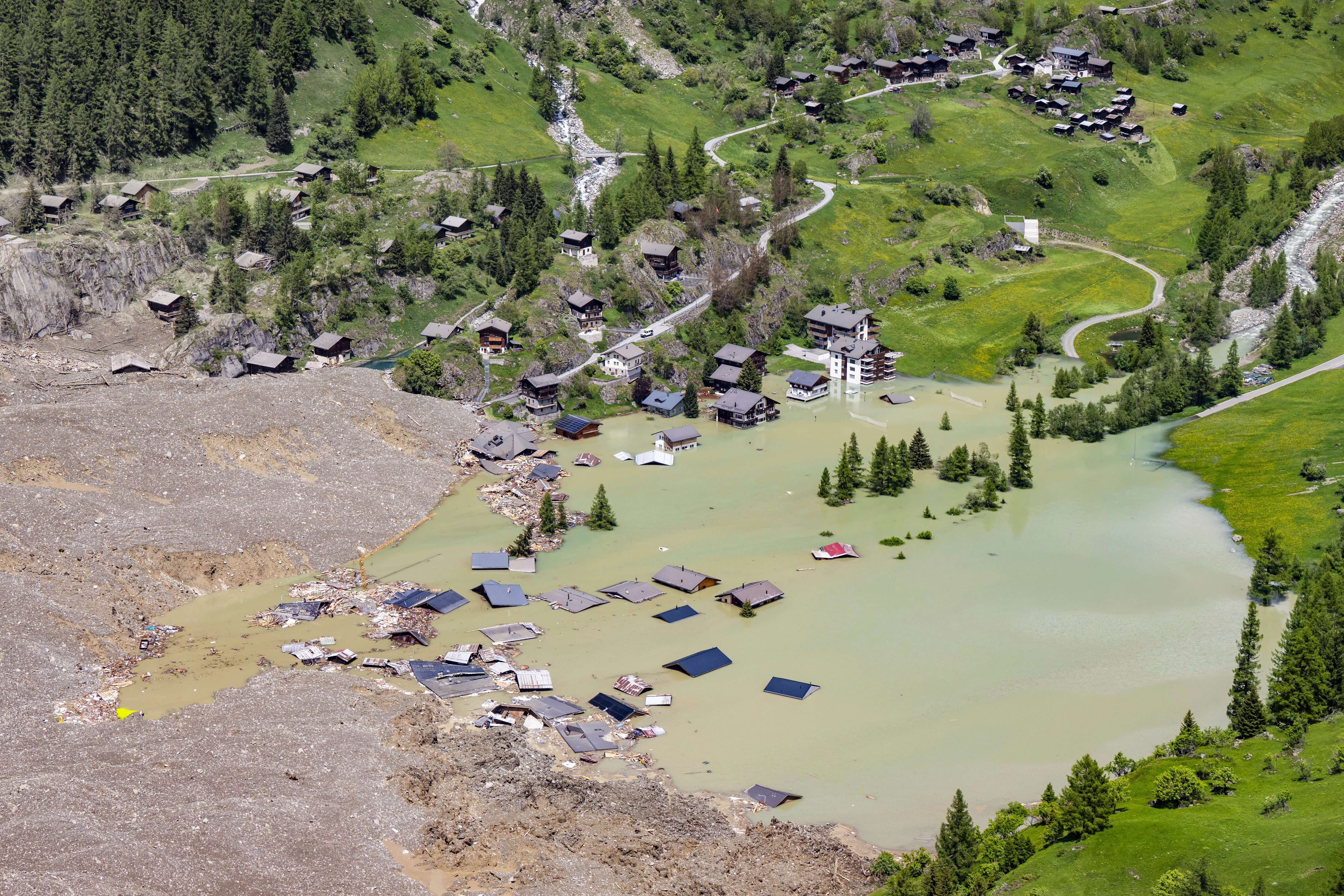 An aerial view shows the destruction of Blatten, Switzerland, Thursday, May 29, 2025, one day after a massive debris avalanche, triggered by the collapse of the Birch Glacier, swept down to the valley floor and demolished large parts of the village. (Jean-Christophe Bott/Keystone via AP)