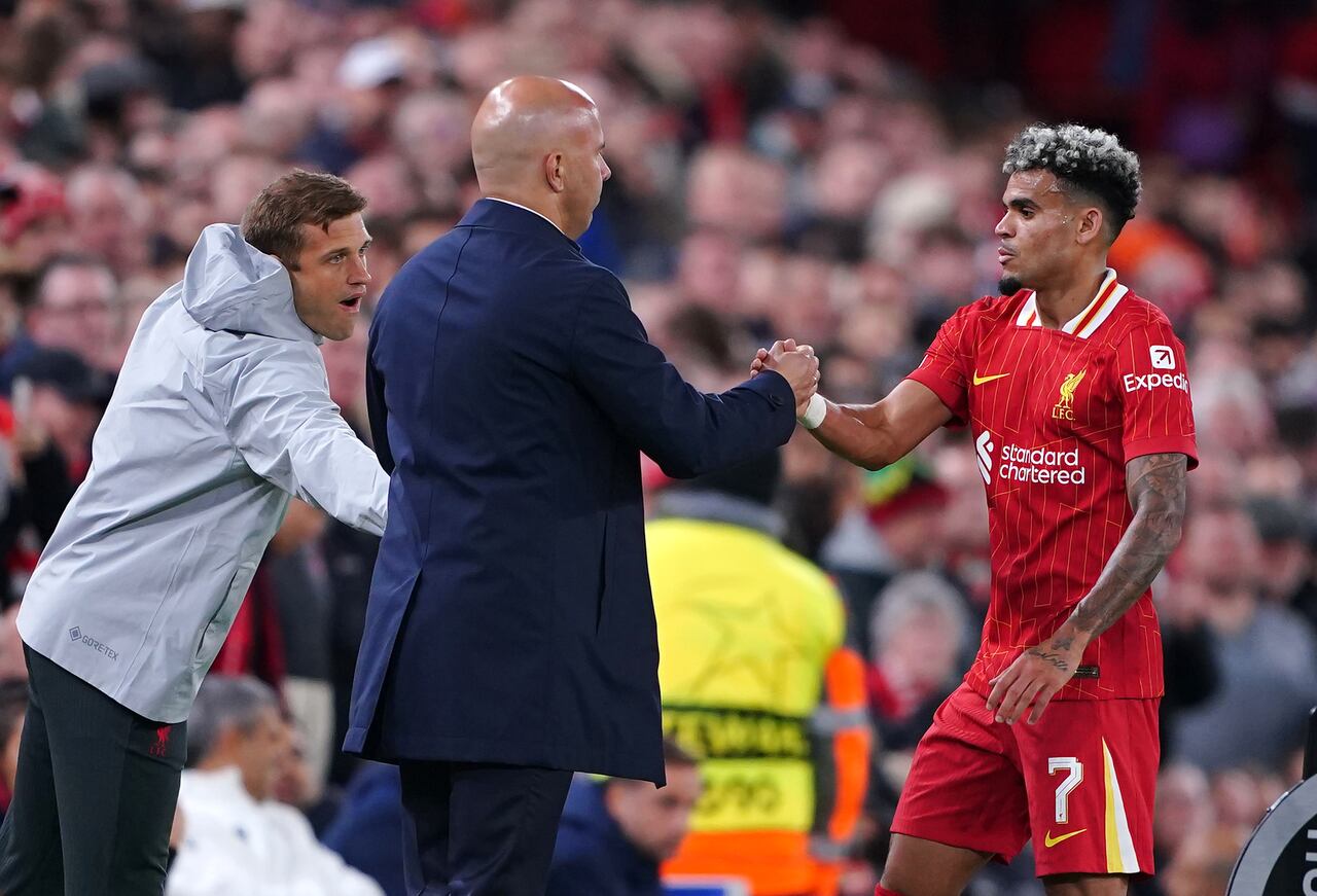 Liverpool manager Arne Slot greets Luis Diaz as he is substituted off during the UEFA Champions League match at Anfield, Liverpool. Picture date: Wednesday October 2, 2024. (Photo by Peter Byrne/PA Images via Getty Images)