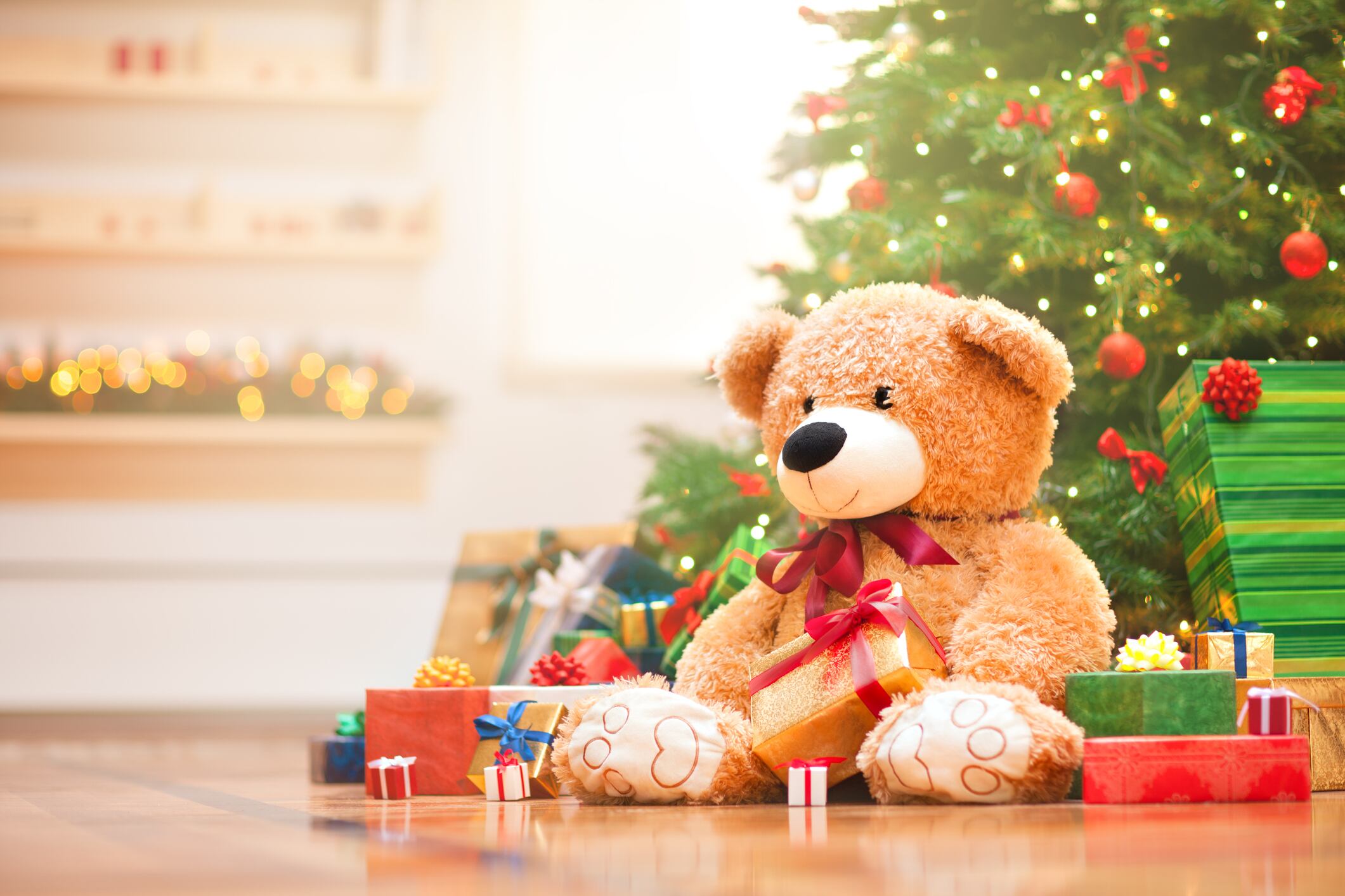 Christmas gifts under christmas tree in the sunny morning.