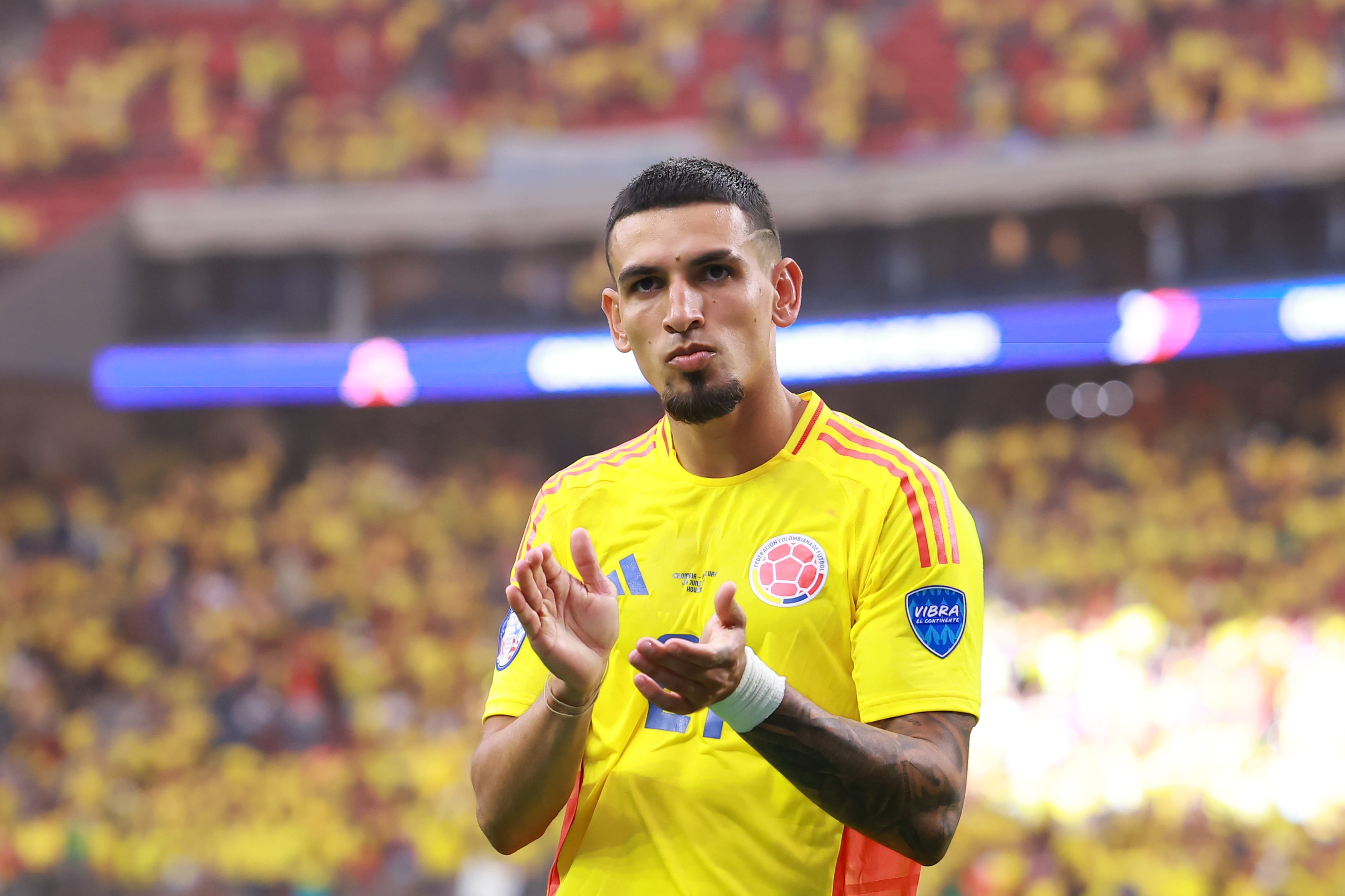 HOUSTON, TEXAS - JUNE 24: Daniel Muñoz of Colombia applauds the fans after winning the CONMEBOL Copa America 2024 Group D match between Colombia and Paraguay at NRG Stadium on June 24, 2024 in Houston, Texas. (Photo by Hector Vivas/Getty Images)