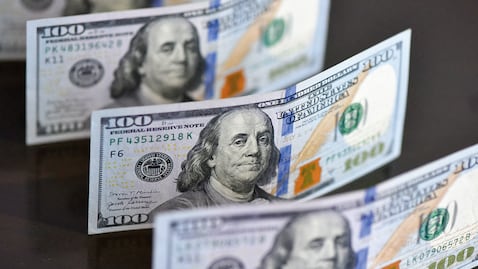 US dollar banknotes are captured in Fuyang City, Anhui Province, China, on March 1, 2026. (Photo by Costfoto/NurPhoto) (Photo by CFOTO / NurPhoto via AFP)