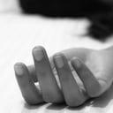 Picture of a numb hand of a woman showing death or unconsciousness