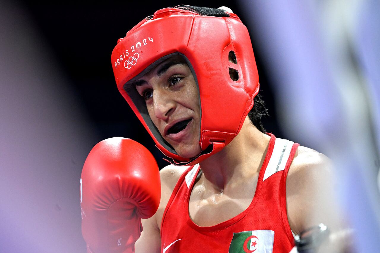 PARIS, FRANCE - AUGUST 1: Algeria's Imane Khelif (in red) is seen during the Women's 66kg preliminary round match against Angela Carini of Italy (not seen) on day six of the Olympic Games Paris 2024 at North Paris Arena on August 01, 2024 in Paris, France. (Photo by Fabio Bozzani/Anadolu via Getty Images)