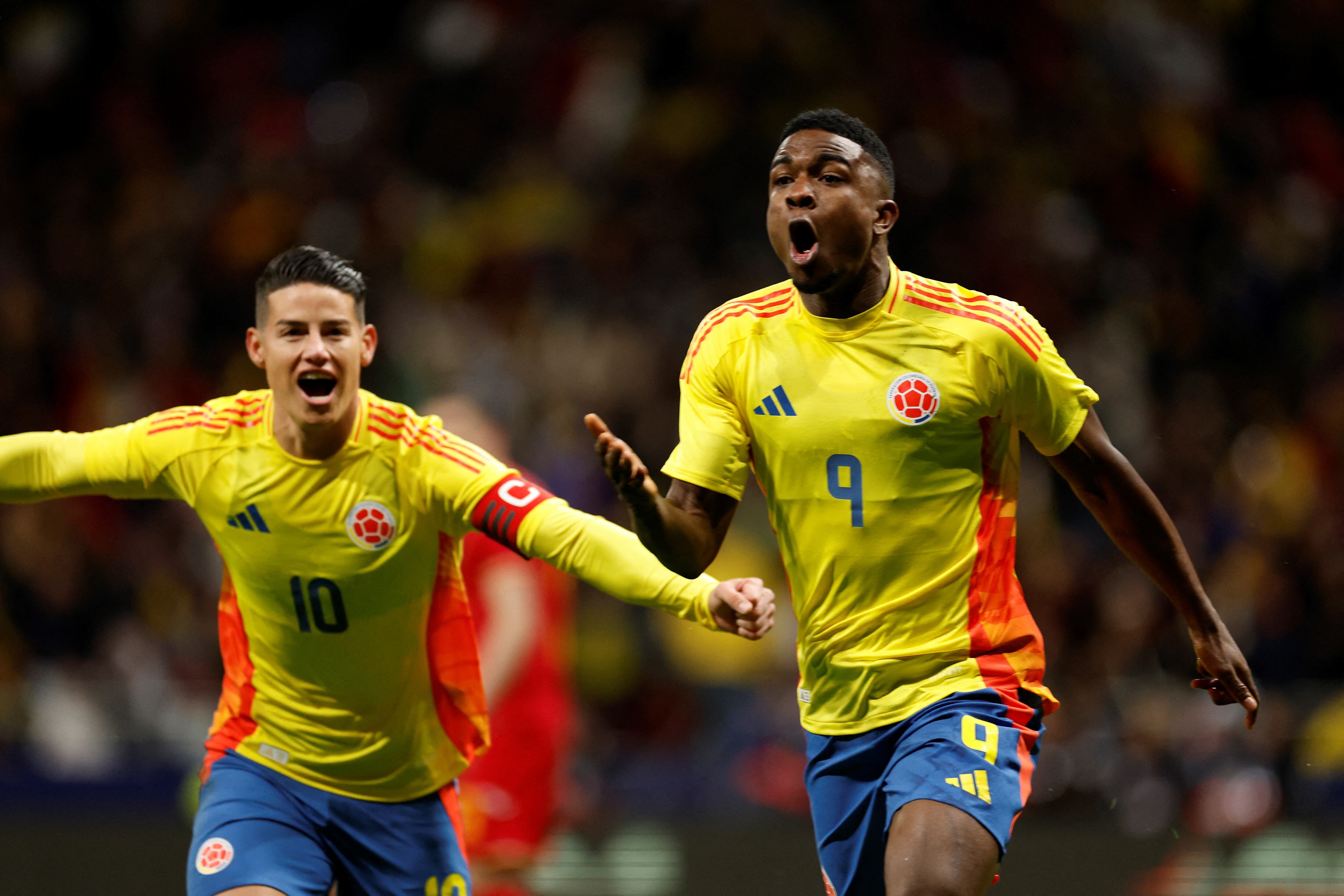 Colombia's forward #09 Jhon Cordoba (R) celebrates scoring his team's first goal during the international friendly football match between Romania and Colombia at the Metropolitano stadium in Madrid on March 26, 2024. (Photo by OSCAR DEL POZO / AFP)