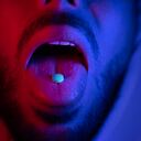 Close up of man mouth swallowing ecstasy drugs. Man taking MDMA ecstasy pill. High quality 4k footage