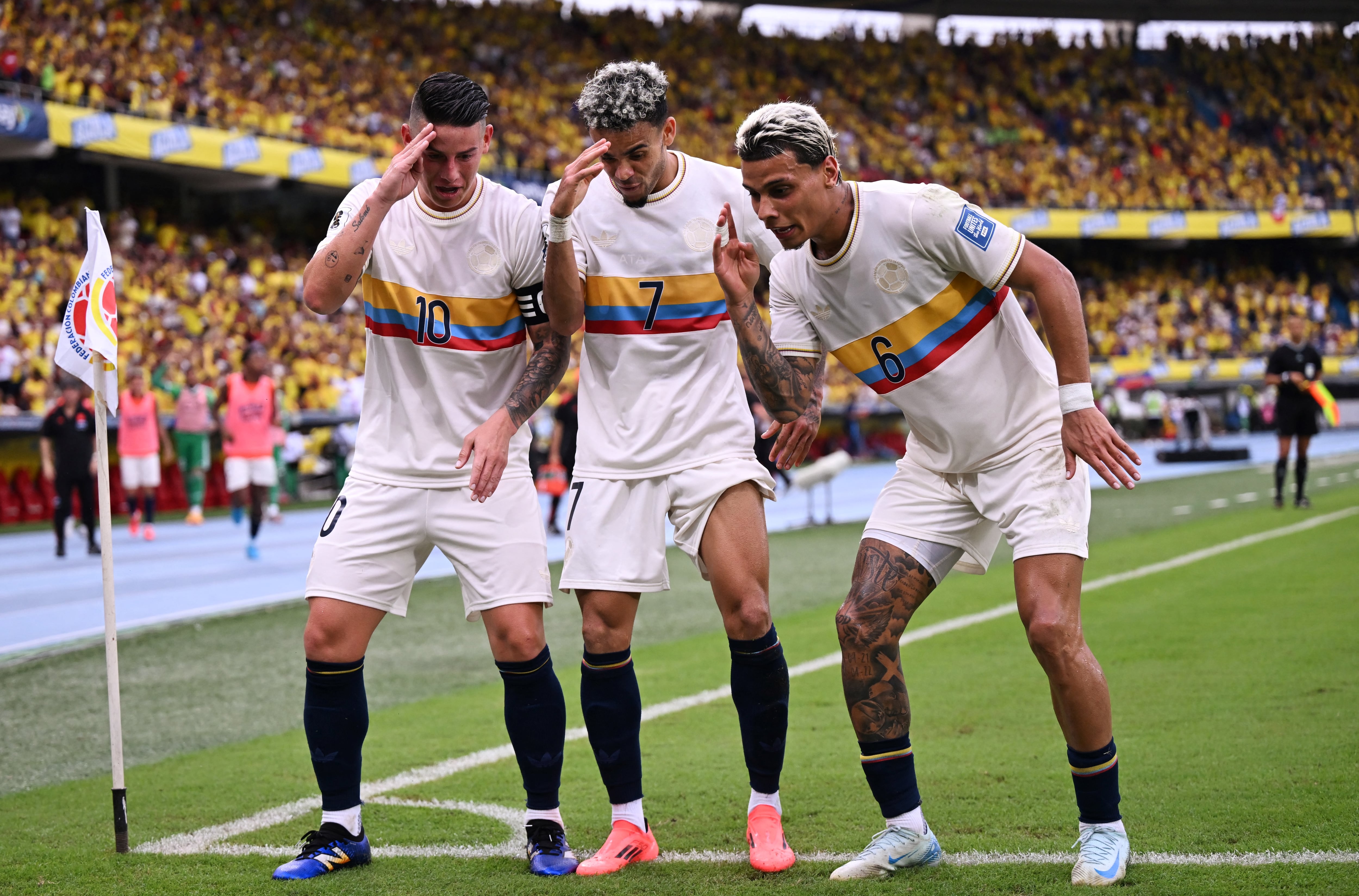Colombia's forward #07 Luis Diaz celebrates with Colombia's midfielder #10 James Rodriguez and Colombia's midfielder #06 Richard R�osafter scoring during the 2026 FIFA World Cup South American qualifiers football match between Colombia and Chile at the Roberto Melendez Metropolitan stadium in Barranquilla, Colombia, on October 15, 2024. (Photo by RAUL ARBOLEDA / AFP)