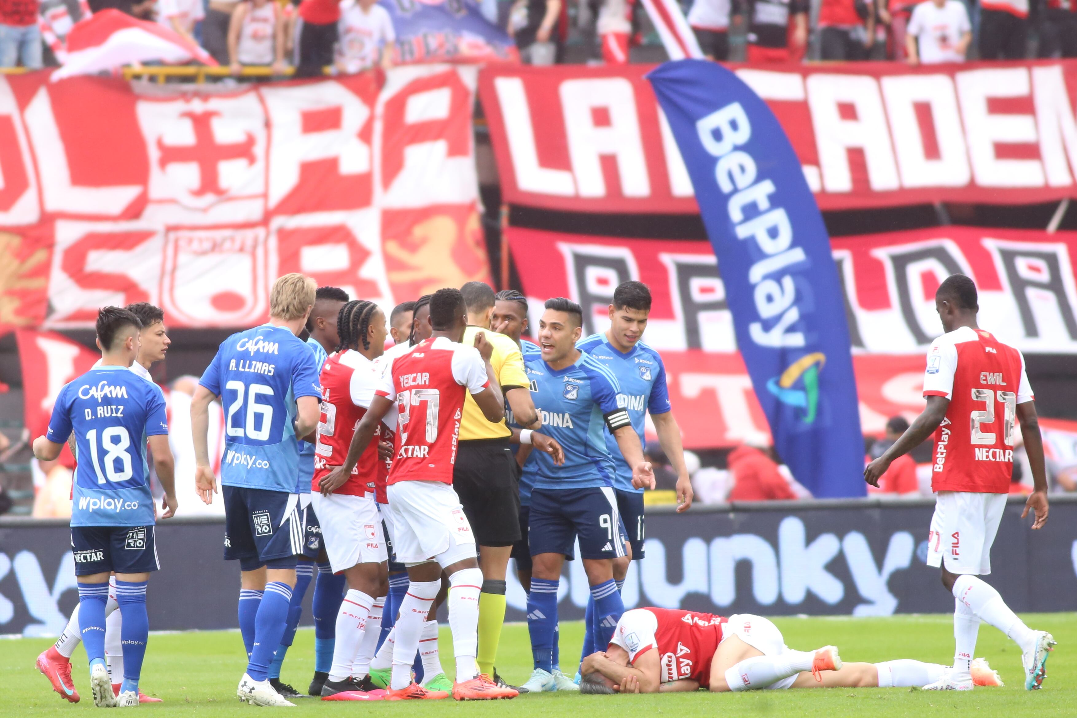 Independiente Santa Fe and Millonarios F.C. players argue in a match for date 1, quadrangular semifinals, as part of the BetPlay DIMAYOR I 2025 League at the Nemesio Camacho El Campin stadium in Bogota, Colombia. (Photo by Daniel Garzon Herazo/NurPhoto via Getty Images)