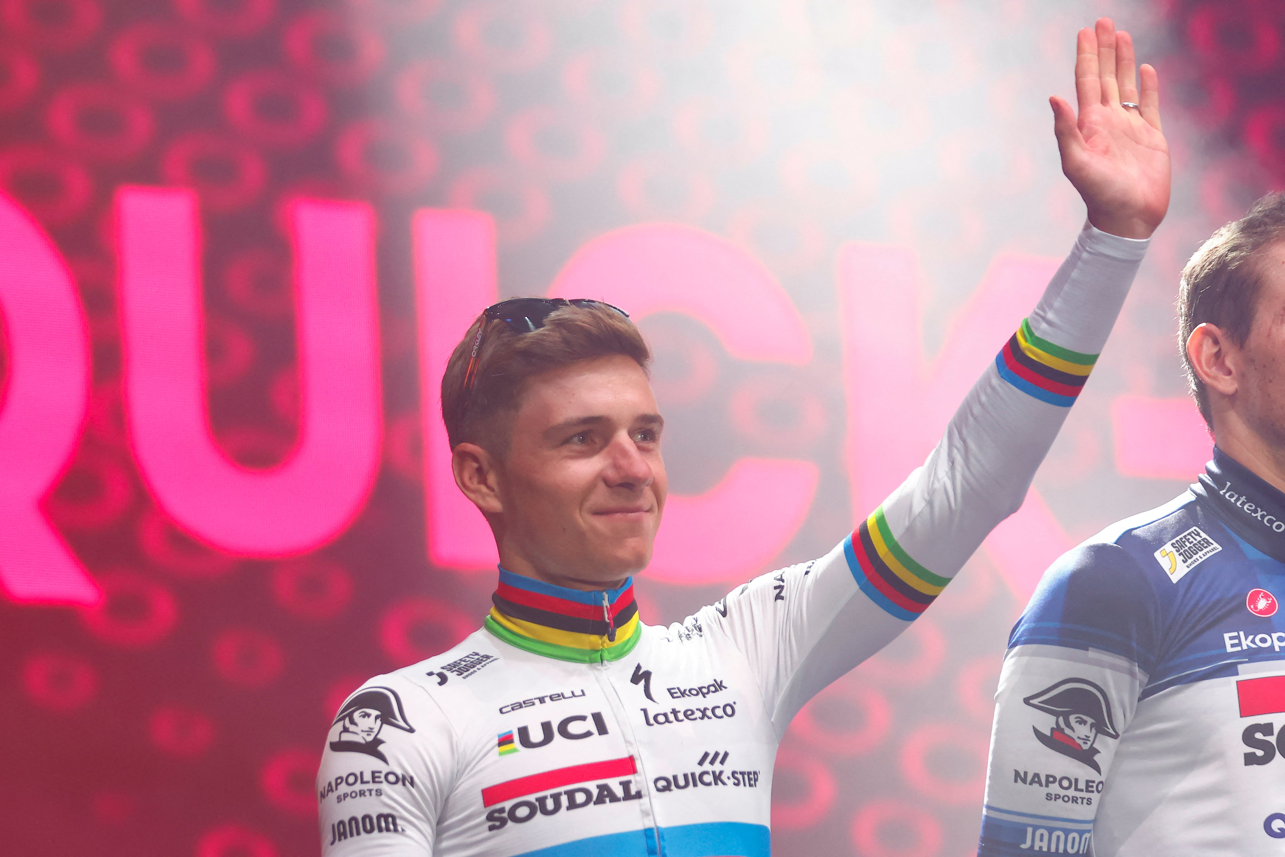 Soudal - Quick Step's Belgian rider Remco Evenepoel waves on stage during the opening ceremony and team presentation in Pescara, on May 4, 2023, two days before the departure of the Giro d'Italia 2023 cycling race. - The Giro d'Italia 2023 cycling race's first stage will depart from Fossacesia Marina on May 6, and finish in Rome on May 28. (Photo by Luca Bettini / AFP)