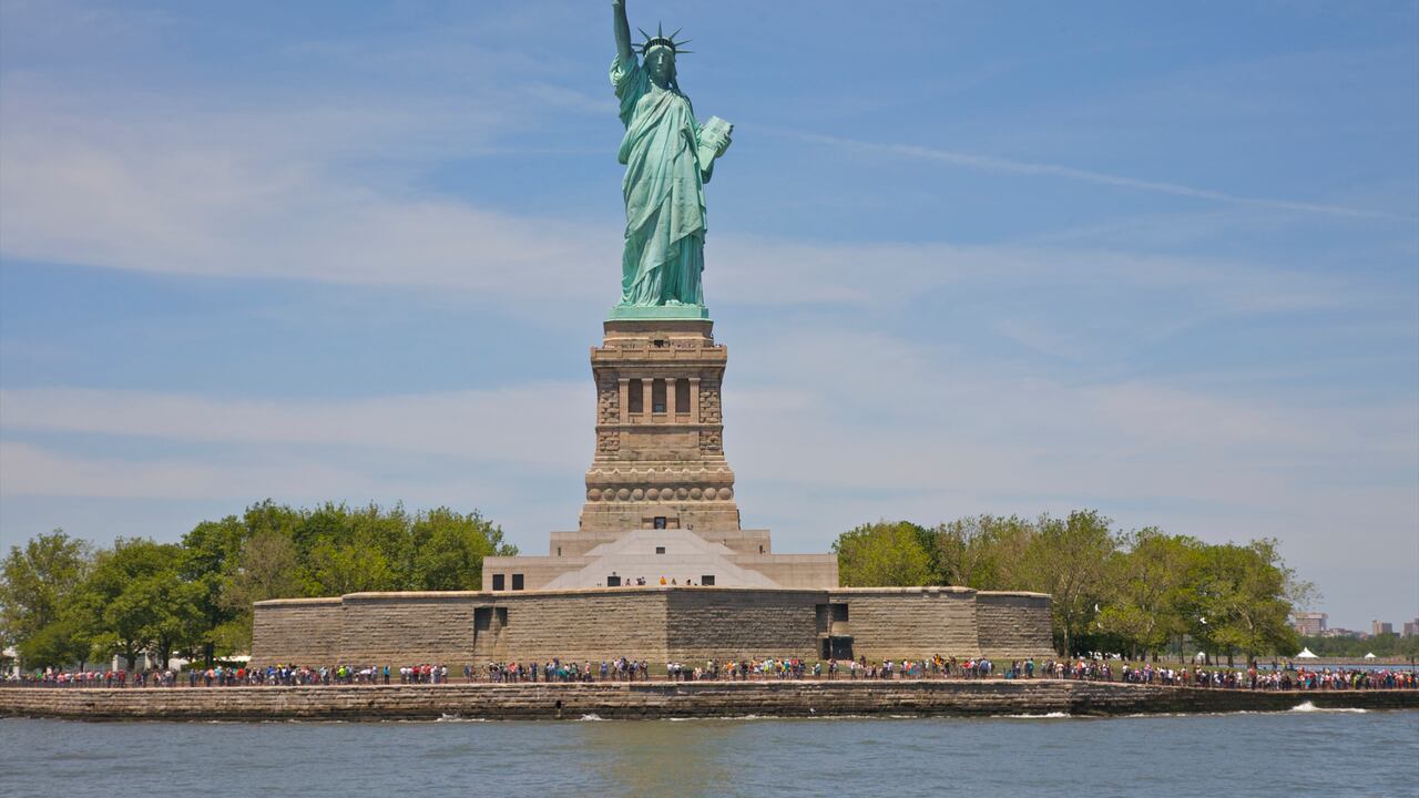 Crowd lined up on Liberty Island below Statue of Liberty, New York, NY, USA.