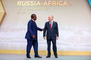 President of the Republic of Guinea-Bissau Umaro Mokhtar Sissoco Embalo, left, and Russian President Vladimir Putin shake hands before an official ceremony to welcome the leaders of delegations to the Russia Africa Summit in St. Petersburg, Russia, Thursday, July 27, 2023. (Sergei Bobylev/TASS Host Photo Agency Pool Photo via AP)