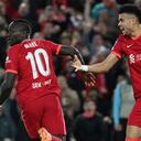 Liverpool's Senegalese striker Sadio Mane (L) celebrates with Liverpool's Colombian midfielder Luis Diaz after scoring his team second goal during the UEFA Champions League semi-final first leg football match between Liverpool and Villarreal, at the Anfield Stadium, in Liverpool, on April 27, 2022.
LLUIS GENE / AFP