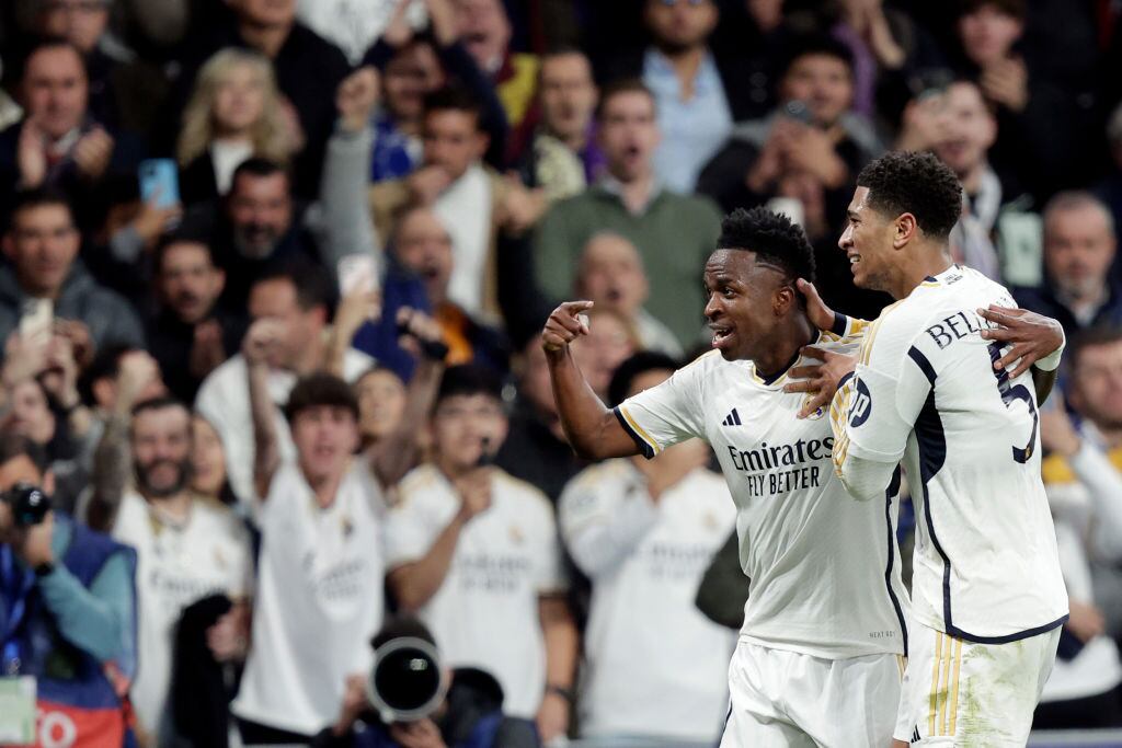 MADRID, SPAIN - MARCH 6: Vinicius Jr of Real Madrid celebrates 1-0 with Jude Bellingham of Real Madrid  during the UEFA Champions League  match between Real Madrid v RB Leipzig at the Estadio Santiago Bernabeu on March 6, 2024 in Madrid Spain (Photo by David S. Bustamante/Soccrates/Getty Images)