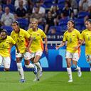 Colombia's Manuela Pavi, left, celebrates with her teammates after scoring during the women's Group A soccer match between France and Colombia at the Lyon stadium during the 2024 Summer Olympics, Thursday, July 25, 2024, in Decines, France. (AP Photo/Laurent Cipriani)