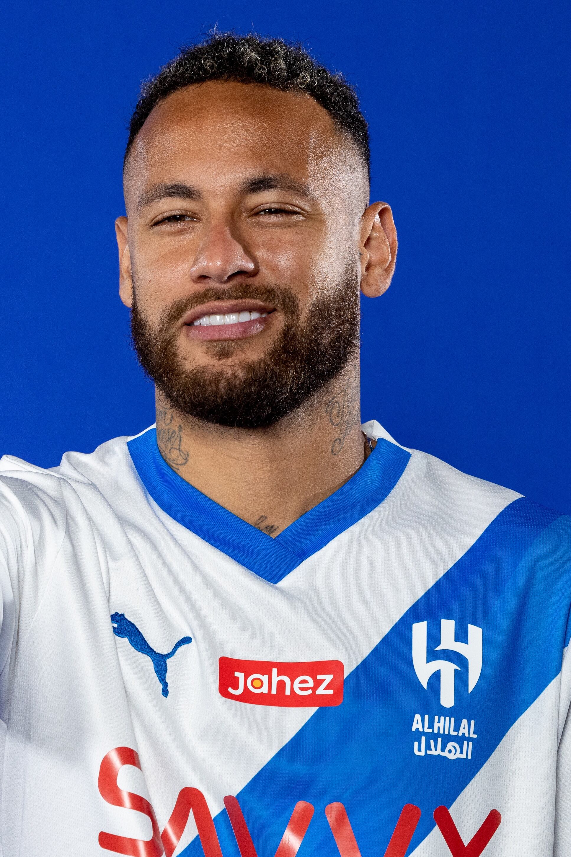 In this handout picture released by the Saudi Al-Hilal football club on August 15, 2023, Brazilian forward Neymar poses for a picture in the team's uniform during a signing ceremony in Paris. Brazil forward Neymar has signed for Saudi Arabia's Al-Hilal from Paris Saint-Germain, the clubs announced today, joining Cristiano Ronaldo and Karim Benzema as the latest big name lured to the oil-rich Gulf state. (Photo by Saudi Pro League / AFP) / �The erroneous mention[s] appearing in the metadata of this photo by - has been modified in AFP systems in the following manner: [in Paris] instead of [in Riyadh]. Please immediately remove the erroneous mention[s] from all your online services and delete it (them) from your servers. If you have been authorized by AFP to distribute it (them) to third parties, please ensure that the same actions are carried out by them. Failure to promptly comply with these instructions will entail liability on your part for any continued or post notification usage. Therefore we thank you very much for all your attention and prompt action. We are sorry for the inconvenience this notification may cause and remain at your disposal for any further information you may require.�