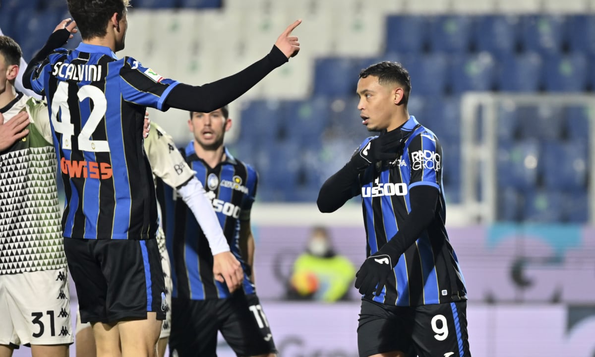 Atalanta's Luis Muriel, right, celebrates scoring his side's opening goal during the Italian Cup soccer match between Atalanta and Venezia at the Gewiss stadium in Bergamo, Italy, Wednesday, Jan. 12, 2022. (AP/Massimo Paolone/LaPresse)