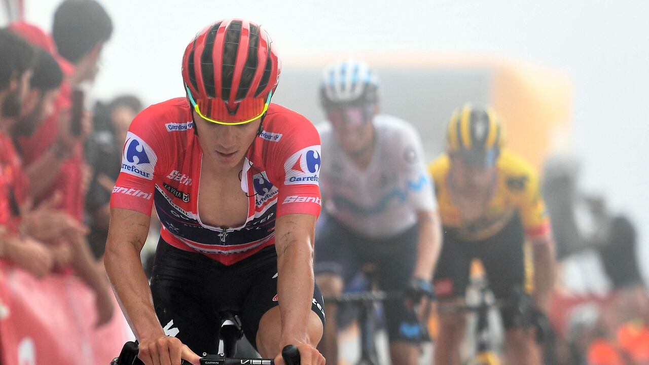 Team Quick Step's Belgian rider Remco Evenepoel crosses the finish line in fifth place during the 8th stage of the 2022 La Vuelta cycling tour of Spain, a 153.4 km race from Pola de Laviana to Collau Fancuaya - Yernes y Tameza, on August 27, 2022. (Photo by ANDER GILLENEA / AFP)