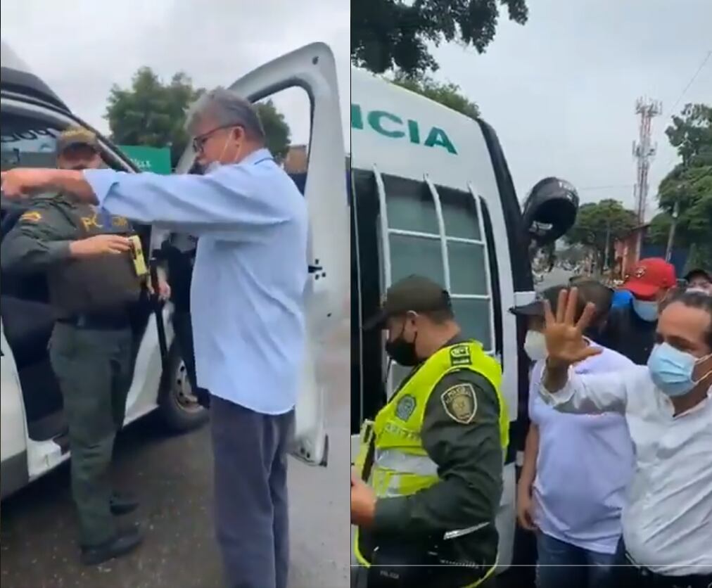 Alexánder López y Wilson Arias discutiendo con Policías