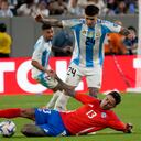 Argentina's Enzo Fernandez (24) and Chile's Erick Pulgar battle for the ball during a Copa America Group A soccer match in East Rutherford, N.J., Tuesday, June 25, 2024. (AP Photo/Pamela Smith)