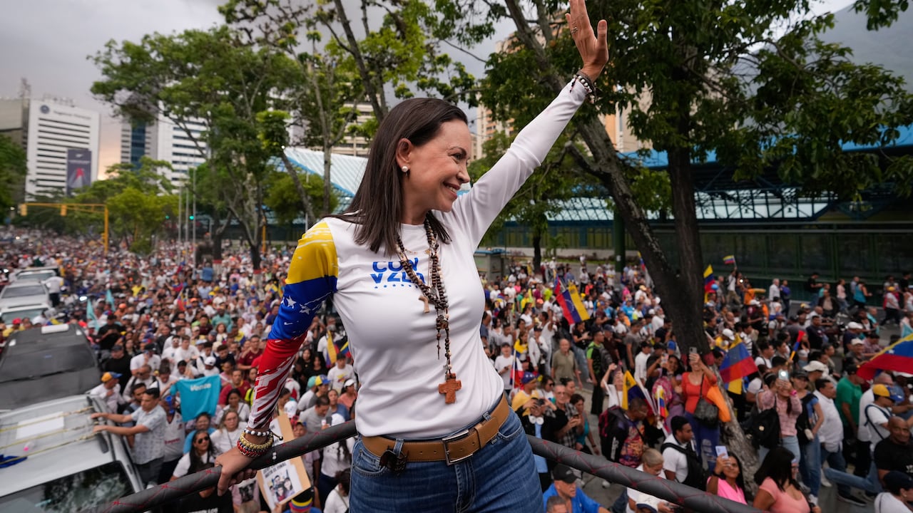 Opposition leader Maria Corina Machado waves during a rally launching the official presidential campaign season, in Caracas, Venezuela, Thursday, July 4, 2024. Venezuelans head to the polls on July 28 as President Nicolas Maduro seeks a third term. (AP Photo/Ariana Cubillos)