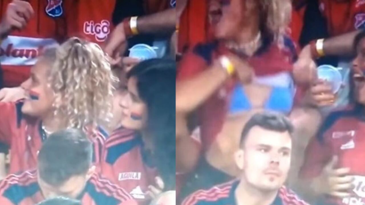 La mujer se levantó la camiseta cuando vio que estaba saliendo en televisión. Foto: Captura Win Sports.