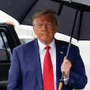 Former President Donald Trump walks over to speak with reporters before he boards his plane at Ronald Reagan Washington National Airport, Thursday, Aug. 3, 2023, in Arlington, Va., after facing a judge on federal conspiracy charges that allege he conspired to subvert the 2020 election. (AP Photo/Alex Brandon)
