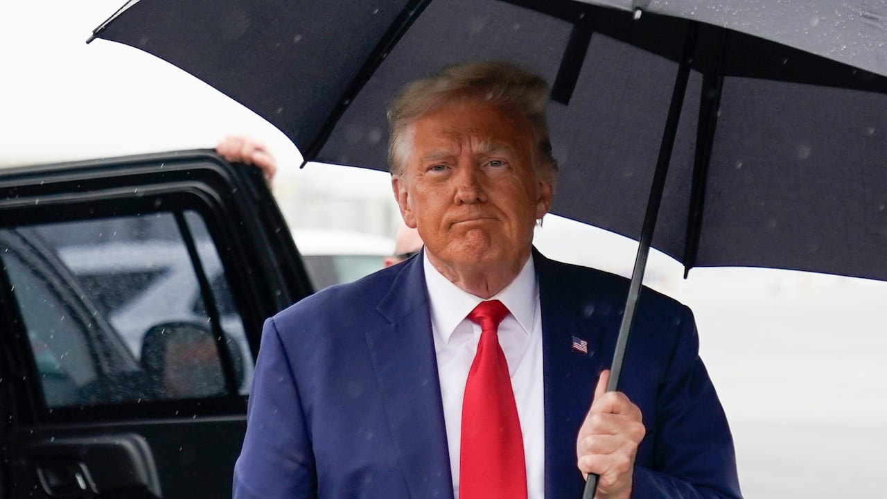 Former President Donald Trump walks over to speak with reporters before he boards his plane at Ronald Reagan Washington National Airport, Thursday, Aug. 3, 2023, in Arlington, Va., after facing a judge on federal conspiracy charges that allege he conspired to subvert the 2020 election. (AP Photo/Alex Brandon)