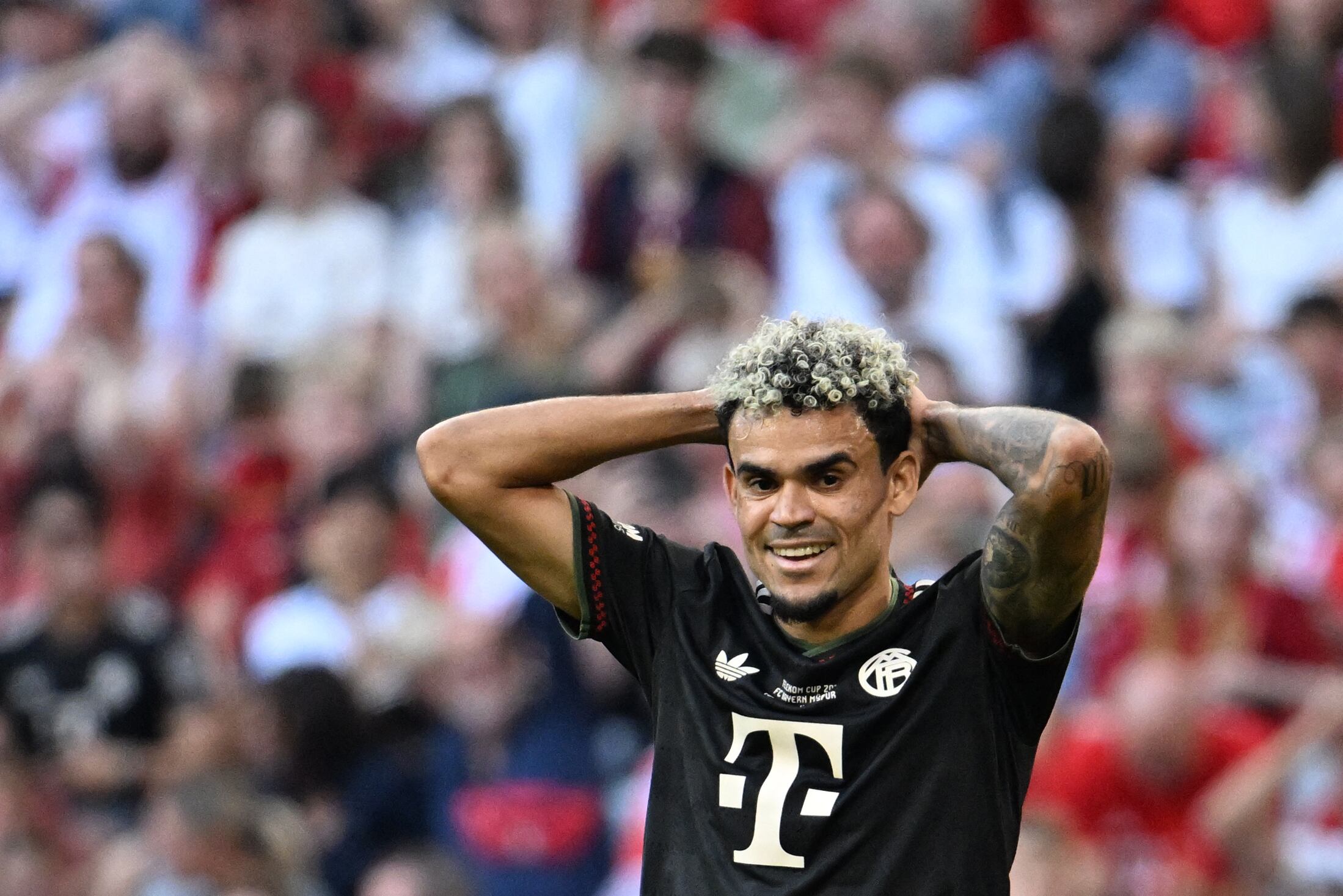 Bayern Munich's Colombian forward #14 Luis Diaz reacts during a friendly football match between FC Bayern Munich and Tottenham Hotspur in Munich, southern Germany, on August 7, 2025. (Photo by LUKAS BARTH-TUTTAS / AFP)