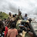FILE - People cheer in celebration as security forces drive through the streets of the capital Bamako, Mali, Wednesday, Aug. 19, 2020, a day after armed soldiers fired into the air outside President Ibrahim Boubacar Keita's home and took him into their custody. The Sahel's latest wave of coups kicked off in Mali in August 2020 when the democratically elected President Ibrahim Boubacar Keïta was overthrown by soldiers led by Col. Assimi Goita. (AP Photo, File)
