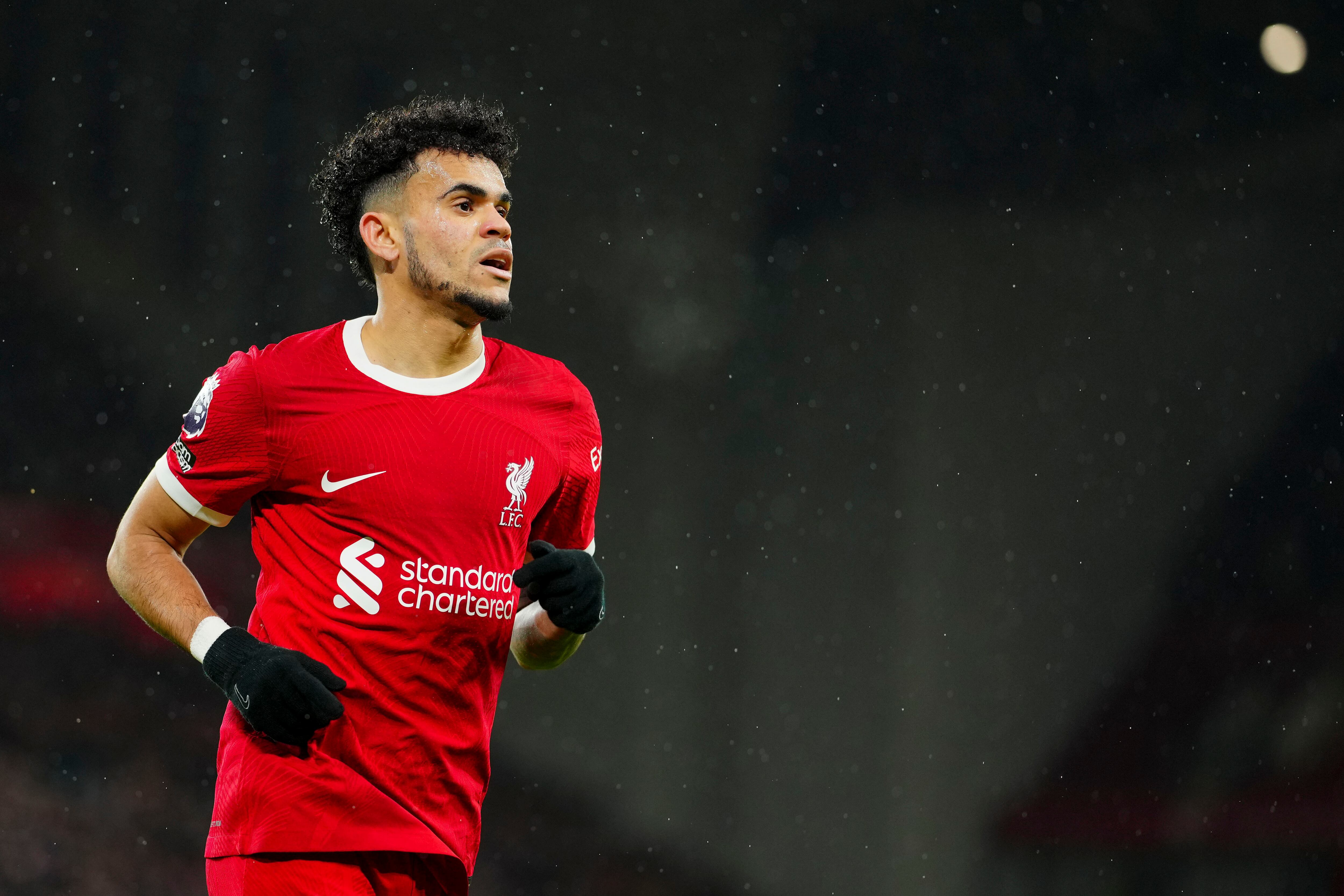 Liverpool's Luis Diaz runs during the English Premier League soccer match between Liverpool and Newcastle, at Anfield stadium in Liverpool, England, Monday, Jan. 1, 2024. (AP Photo/Jon Super)
