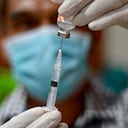 A health worker prepares a dose of the Sinovac Covid-19 coronavirus vaccine at a convention hall building in Banda Aceh on July 26, 2021. (Photo by CHAIDEER MAHYUDDIN / AFP)