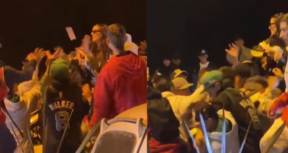 Mujer causa revuelo en Medellín al lanzar billetes al aire.