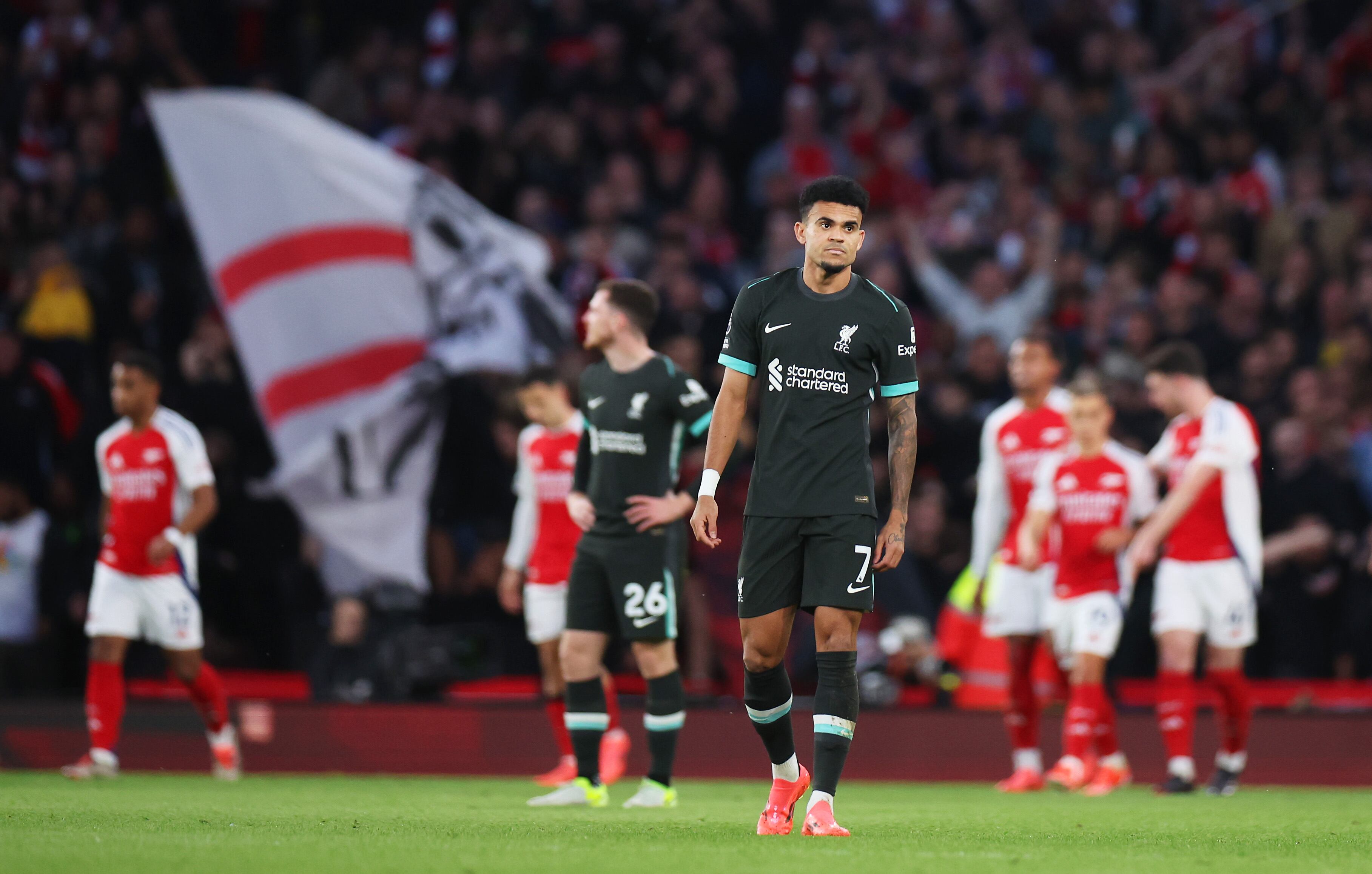 LONDON, ENGLAND - OCTOBER 27: Luis Diaz of Liverpool looks dejected after Bukayo Saka of Arsenal (not pictured) scores his team's first goal during the Premier League match between Arsenal FC and Liverpool FC at Emirates Stadium on October 27, 2024 in London, England. (Photo by Alex Pantling/Getty Images)