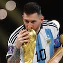 Soccer Football - FIFA World Cup Qatar 2022 - Final - Argentina v France - Lusail Stadium, Lusail, Qatar - December 18, 2022 Argentina's Lionel Messi kisses the World Cup trophy after collecting the Golden Ball award REUTERS/Carl Recine