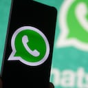 WhatsApp logo displayed on a phone screen, smartphone and keyboard are seen in this multiple exposure illustration. WhatsApp Messenger is a multiplatform mobile application that provides an encrypted instant messaging system belonging to Facebook, photo taken in Amsterdam, Netherlands on January 28, 2020 (Photo illustration by Nicolas Economou/NurPhoto via Getty Images)