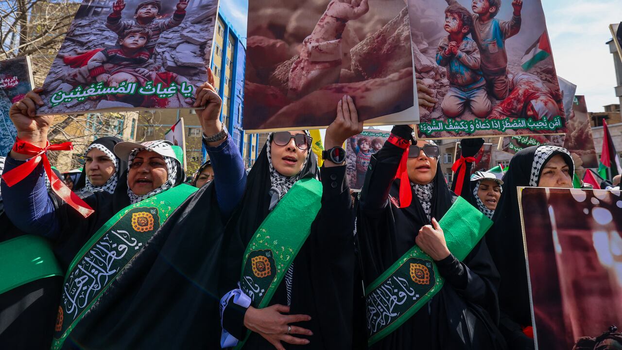 People attend the funeral procession for seven Islamic Revolutionary Guard Corps members killed in a strike in Syria, which Iran blamed on Israel, in Tehran on April 5, 2024. The Guards, including two generals, were killed in the air strike on April 1, which levelled the Iranian embassy's consular annex in Damascus. The funeral ceremony coincides with the annual Quds (Jerusalem) Day commemorations, when Iran and its allies stage marches in support of the Palestinians. (Photo by ATTA KENARE / AFP)