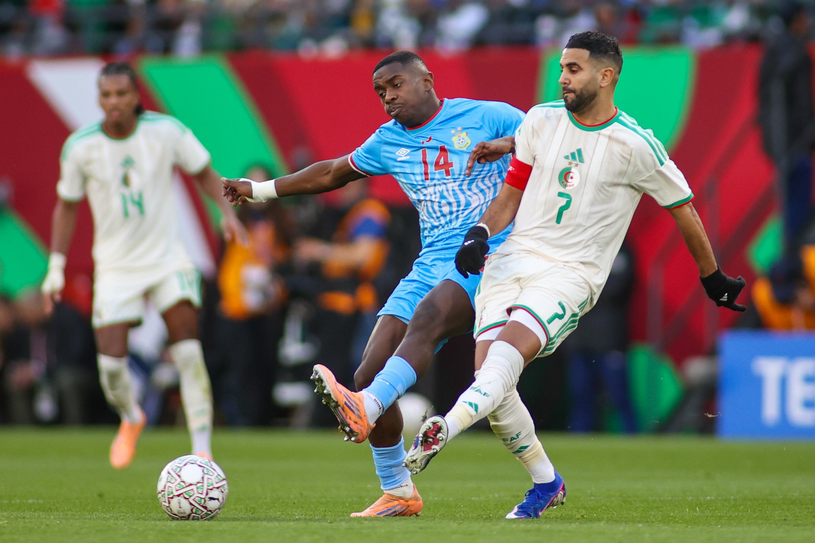 Rabat, Morocco - January 6: Algeria's Riyad Mahrez passes the ball as DR Congo's Noah Sadiki comes in to stop him during the Africa Cup Of Nations Round Of 16 match between Algeria and DR Congo at Moulay Hassan Stadium on January 6, 2026 in Rabat, Morocco. (Photo by Torbjorn Tande/DeFodi Images/DeFodi via Getty Images)