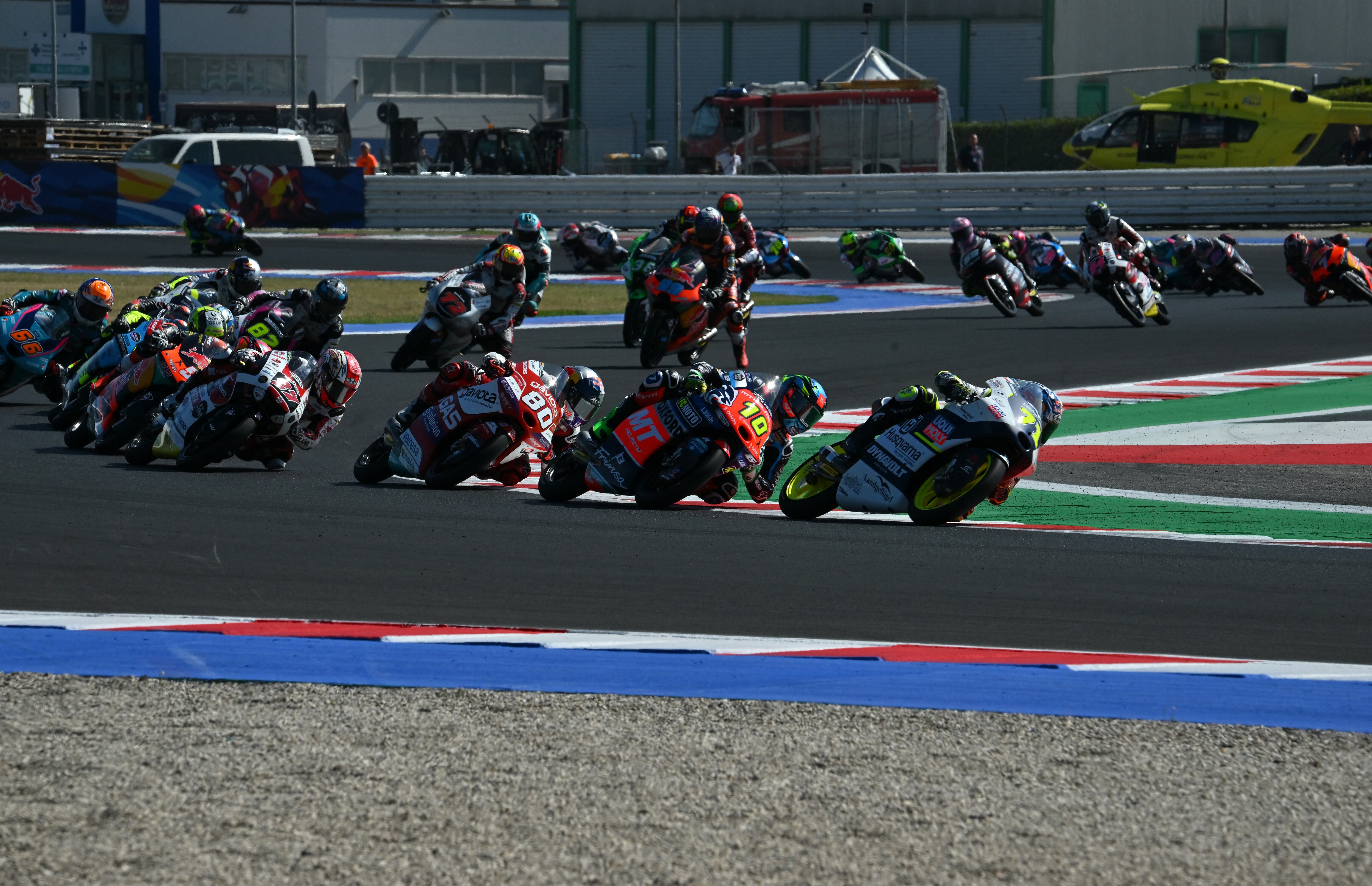 Liqui Moly Husqvarna Intact GP Japanese rider Ayumu Sasaki (front) followed by MT Helmets MSI's Brazilian rider Diogo Moreira (#10), GASGAS Aspar Team Colombian rider David Alonso (#80), and SIC58 Squadra Corse Japanese rider Kaito Toba (#27) compete during the San Marino Moto3 race at the Misano World Circuit Marco-Simoncelli in Misano Adriatico on September 10, 2023. (Photo by Filippo MONTEFORTE / AFP)