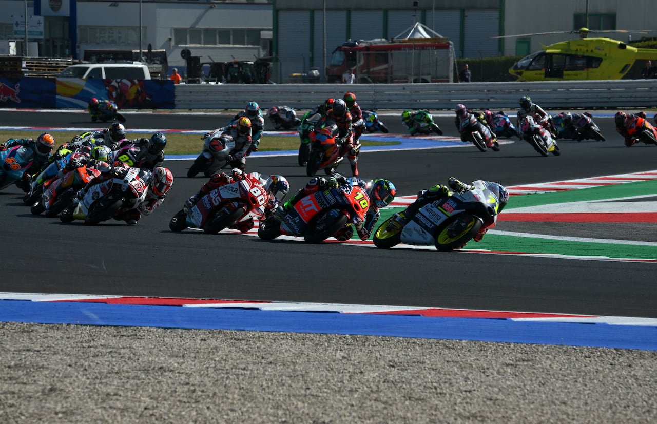 Liqui Moly Husqvarna Intact GP Japanese rider Ayumu Sasaki (front) followed by MT Helmets MSI's Brazilian rider Diogo Moreira (#10), GASGAS Aspar Team Colombian rider David Alonso (#80), and SIC58 Squadra Corse Japanese rider Kaito Toba (#27) compete during the San Marino Moto3 race at the Misano World Circuit Marco-Simoncelli in Misano Adriatico on September 10, 2023. (Photo by Filippo MONTEFORTE / AFP)