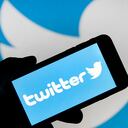 PARIS, FRANCE - FEBRUARY 07: In this photo illustration the Twitter logo is displayed on the screen of an iPhone in front of a computer screen displaying a Twitter logo on February 07, 2019 in Paris, France. Twitter today posted better than expected Wall Street results over the last three months of 2018, with net profit up 28% and revenue up 4%, but the stock is falling. After losing 5 million monthly users by the end of 2018, the social network Twitter decided to stop giving figures. In its financial results for the fourth quarter of 2018, the company explains that this announcement will take effect in the second quarter of 2019. (Photo by Chesnot/Getty Images)