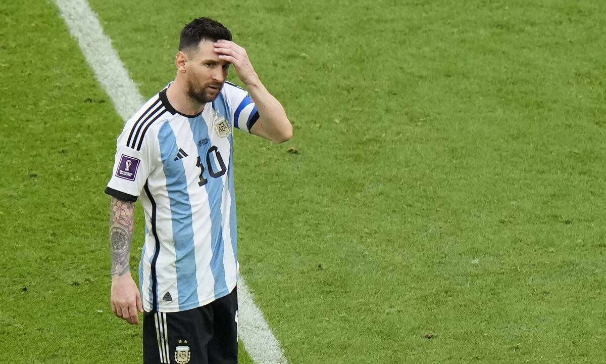 Argentina's Lionel Messi reacts during the World Cup group C soccer match between Argentina and Saudi Arabia at the Lusail Stadium in Lusail, Qatar, Tuesday, Nov. 22, 2022. (AP/Luca Bruno)