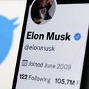 Elon Musk's Twitter profile displayed on a phone screen and Twitter logo displayed on a screen are seen in this illustration photo taken in Krakow, Poland on September 15, 2022. (Photo by Jakub Porzycki/NurPhoto via Getty Images)